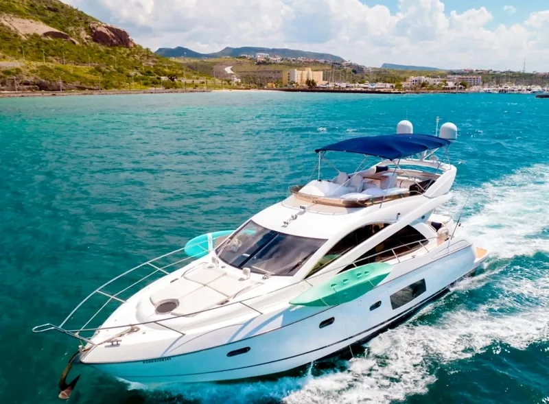 Motor yacht anchored in turquoise water Motor yacht anchored in turquoise water