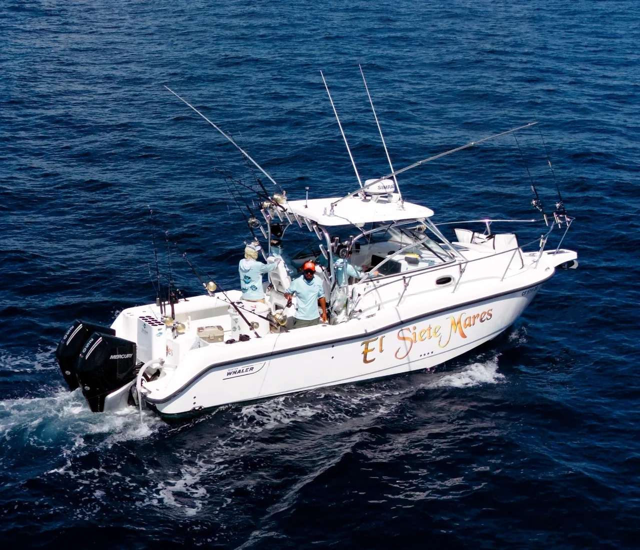 Sportfishing boat with fishing rods on open water