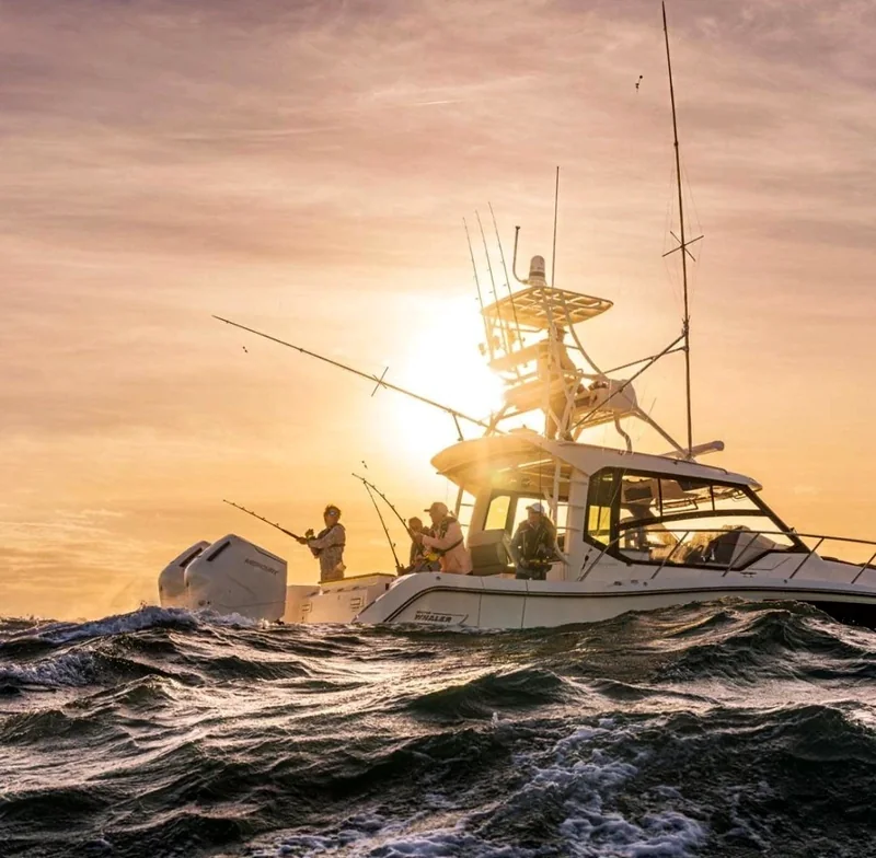 Sportfishing boat underway at sunset Sportfishing boat underway at sunset