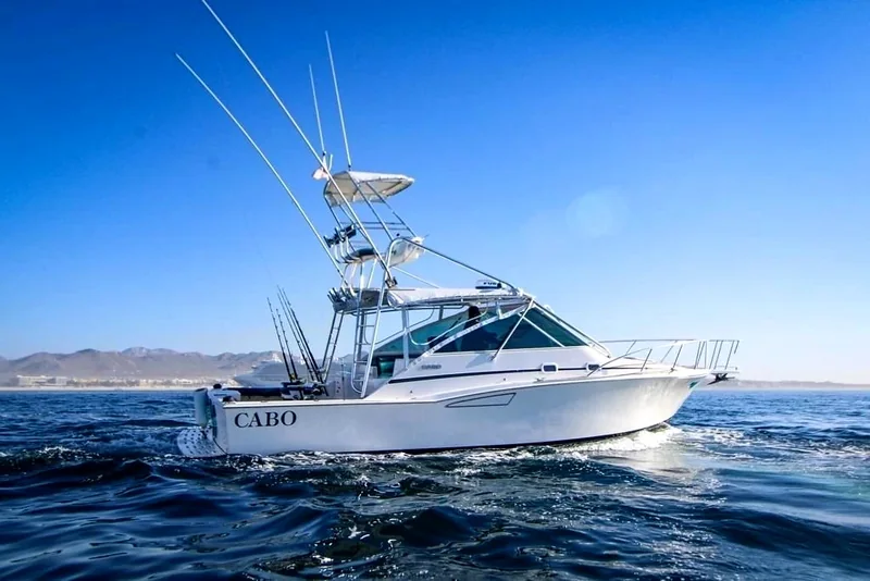 Sportfishing boat underway on blue water Sportfishing boat underway on blue water