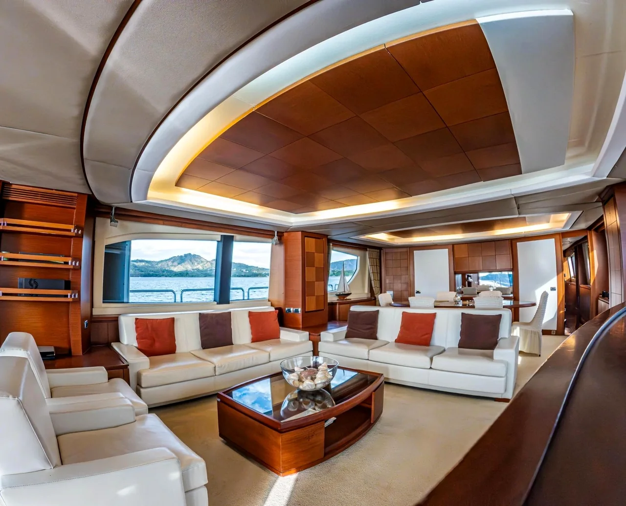 Yacht salon with wood cabinetry and lounge seating