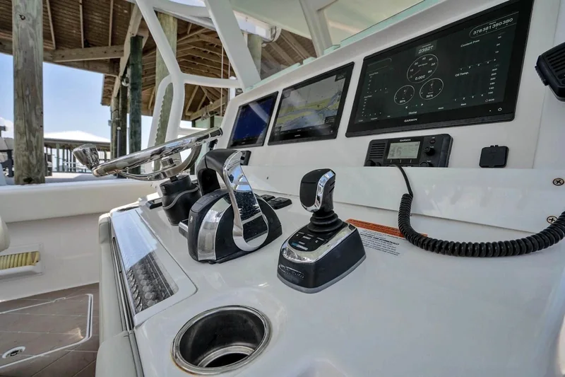 Boat helm with steering wheel and navigation screens Boat helm with steering wheel and navigation screens