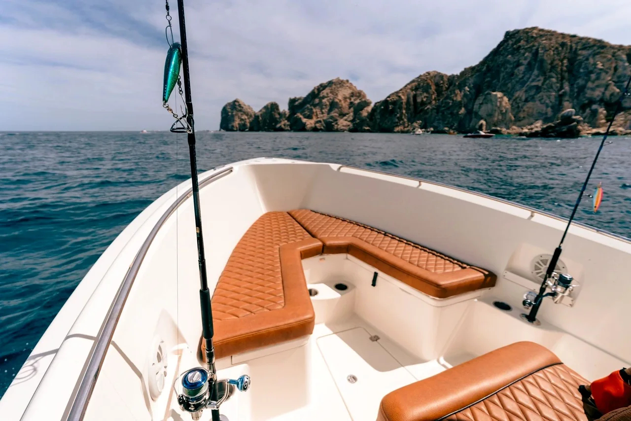 Yacht foredeck seating near rocky coastline